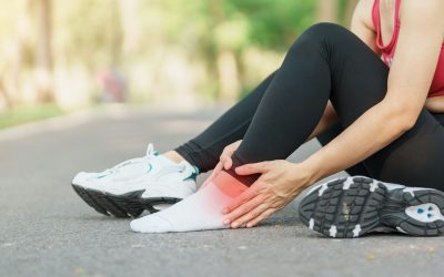 Young adult female with his muscle pain during running. runner woman having leg ache due to Ankle Sprains or Achilles Tendonitis. Sports injuries and medical concept